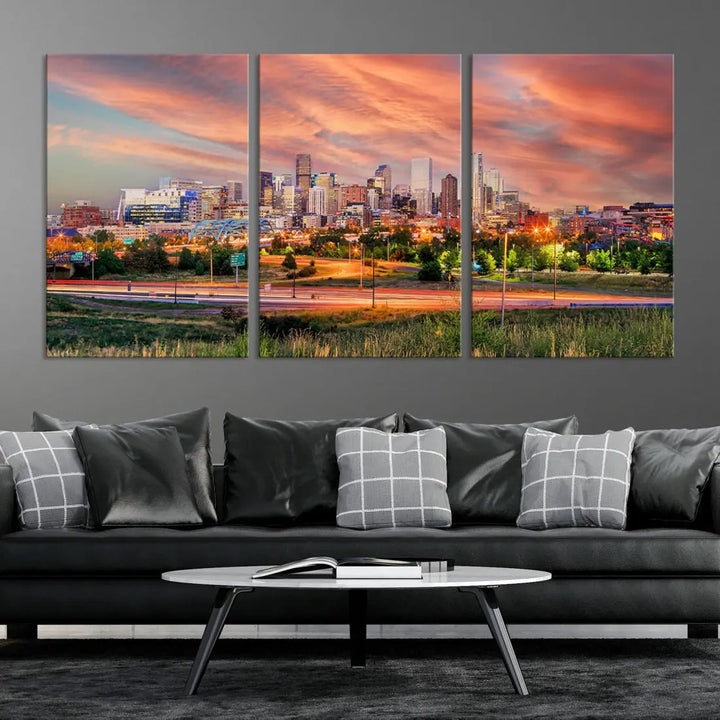 The modern living room showcases the "Denver City Lights Sunset Orange Cloudy Skyline Cityscape View Wall Art Canvas Print," a triptych of museum-quality canvases depicting a city skyline at sunset. This ready-to-hang artwork boasts a UV-protective coating to ensure lasting vibrancy.