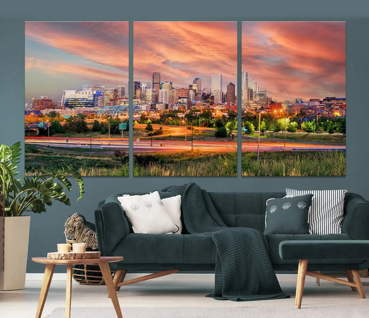 The modern living room showcases the "Denver City Lights Sunset Orange Cloudy Skyline Cityscape View Wall Art Canvas Print," a triptych of museum-quality canvases depicting a city skyline at sunset. This ready-to-hang artwork boasts a UV-protective coating to ensure lasting vibrancy.