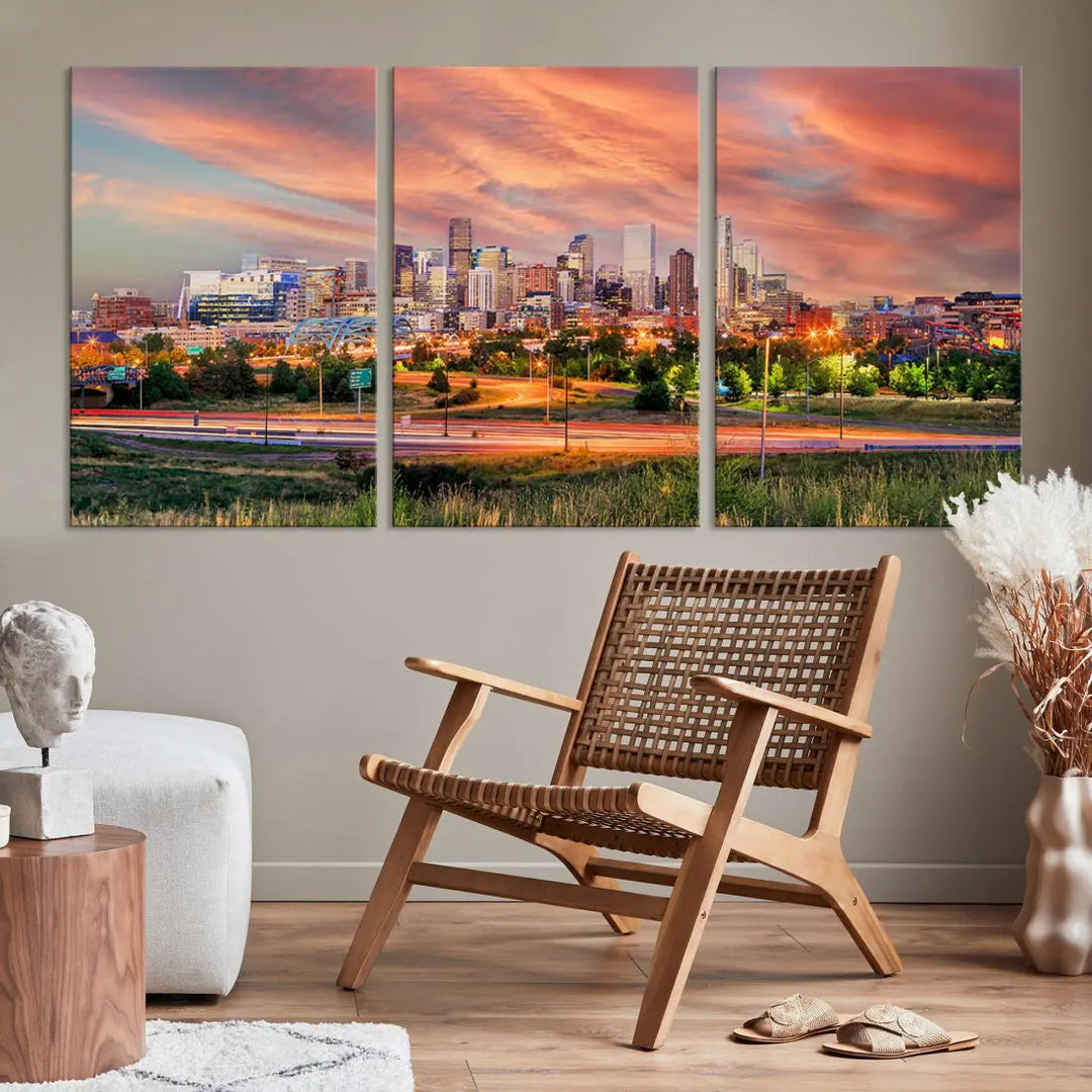 The modern living room showcases the "Denver City Lights Sunset Orange Cloudy Skyline Cityscape View Wall Art Canvas Print," a triptych of museum-quality canvases depicting a city skyline at sunset. This ready-to-hang artwork boasts a UV-protective coating to ensure lasting vibrancy.