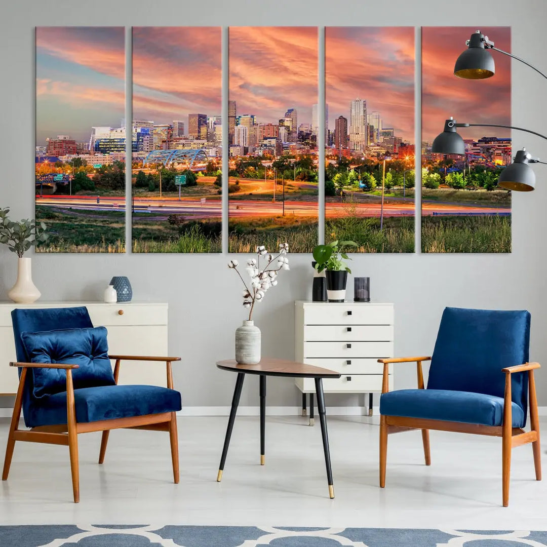 The modern living room showcases the "Denver City Lights Sunset Orange Cloudy Skyline Cityscape View Wall Art Canvas Print," a triptych of museum-quality canvases depicting a city skyline at sunset. This ready-to-hang artwork boasts a UV-protective coating to ensure lasting vibrancy.