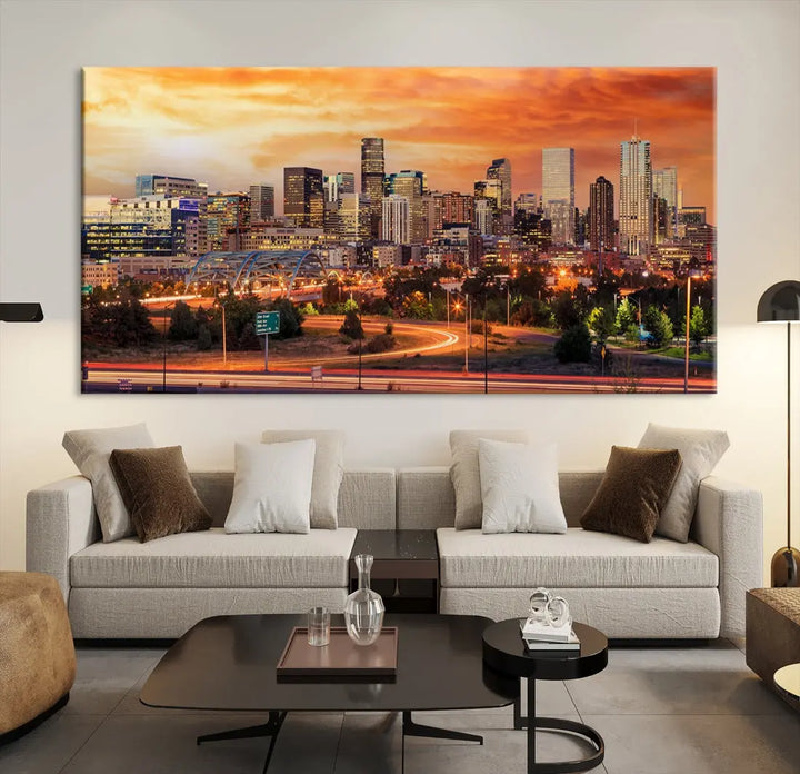 The Denver City Lights Sunset Orange Skyline Cityscape View Wall Art Canvas Print features a vibrant city skyline at sunset with orange and yellow skies. Crafted on museum-quality canvas with a UV-protective coating, it showcases the artistry of a professional craftsman.