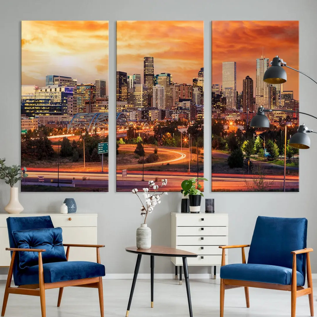 The Denver City Lights Sunset Orange Skyline Cityscape View Wall Art Canvas Print features a vibrant city skyline at sunset with orange and yellow skies. Crafted on museum-quality canvas with a UV-protective coating, it showcases the artistry of a professional craftsman.