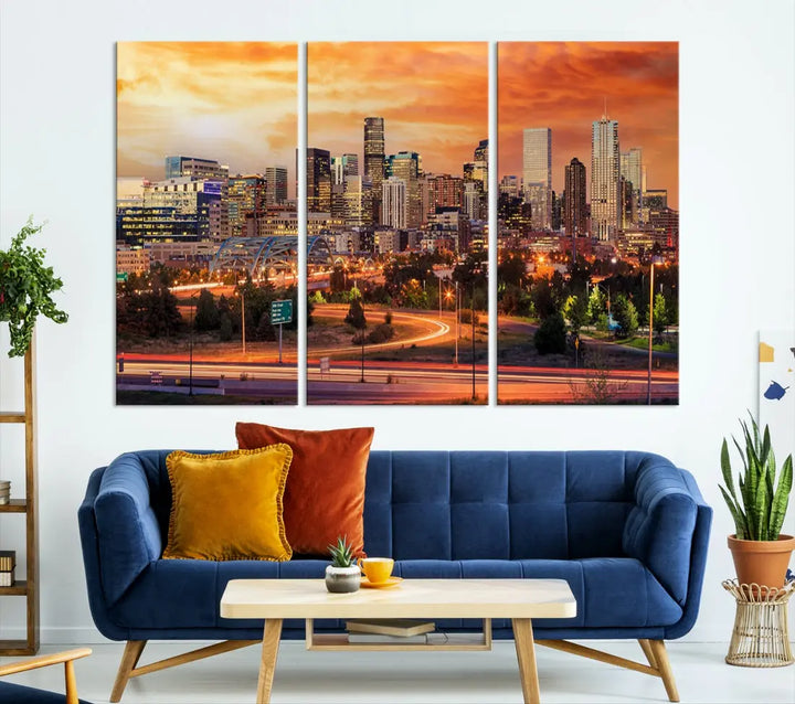 The Denver City Lights Sunset Orange Skyline Cityscape View Wall Art Canvas Print features a vibrant city skyline at sunset with orange and yellow skies. Crafted on museum-quality canvas with a UV-protective coating, it showcases the artistry of a professional craftsman.