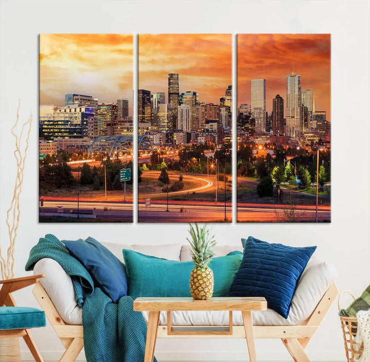 The Denver City Lights Sunset Orange Skyline Cityscape View Wall Art Canvas Print features a vibrant city skyline at sunset with orange and yellow skies. Crafted on museum-quality canvas with a UV-protective coating, it showcases the artistry of a professional craftsman.