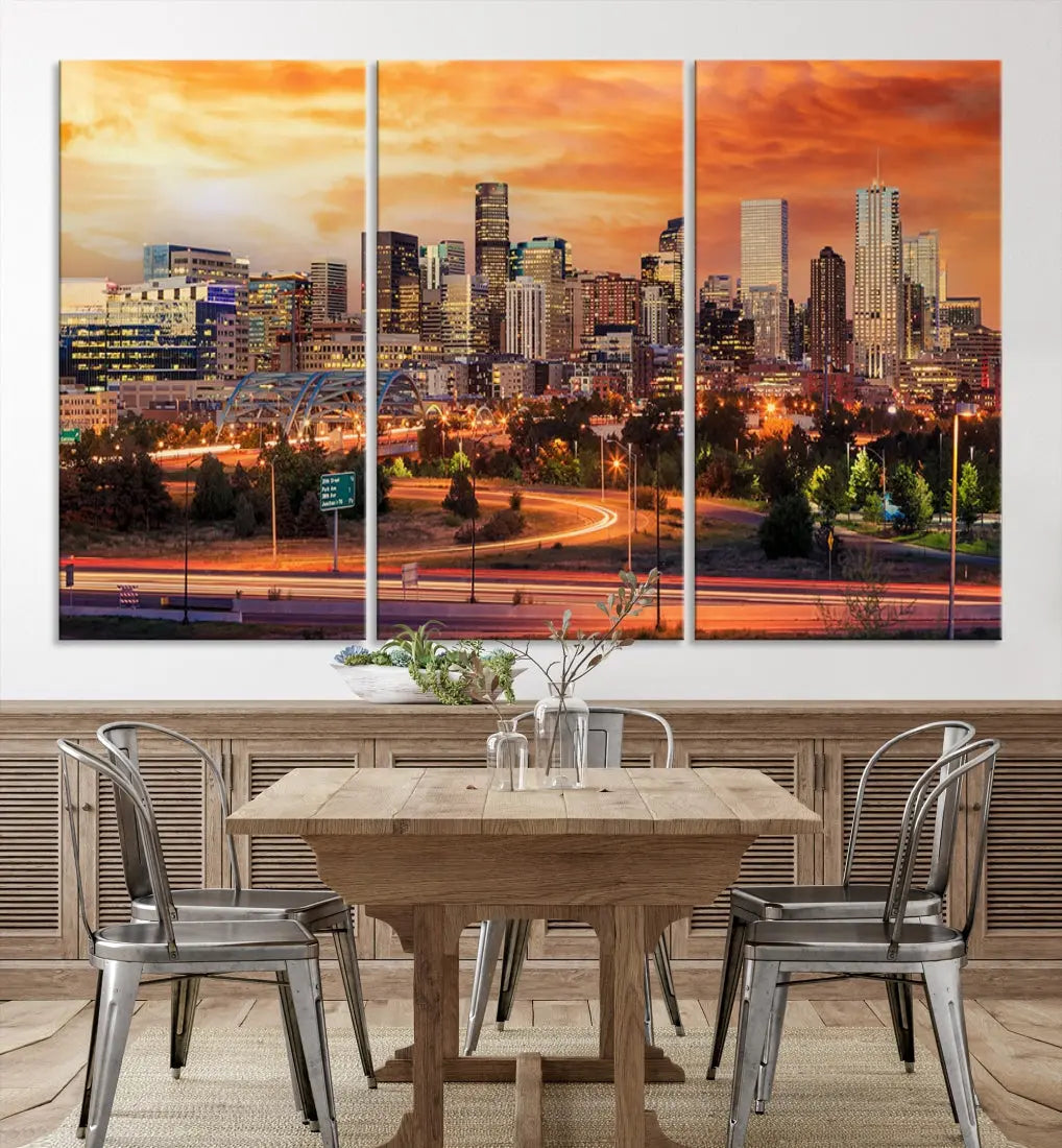 The Denver City Lights Sunset Orange Skyline Cityscape View Wall Art Canvas Print features a vibrant city skyline at sunset with orange and yellow skies. Crafted on museum-quality canvas with a UV-protective coating, it showcases the artistry of a professional craftsman.