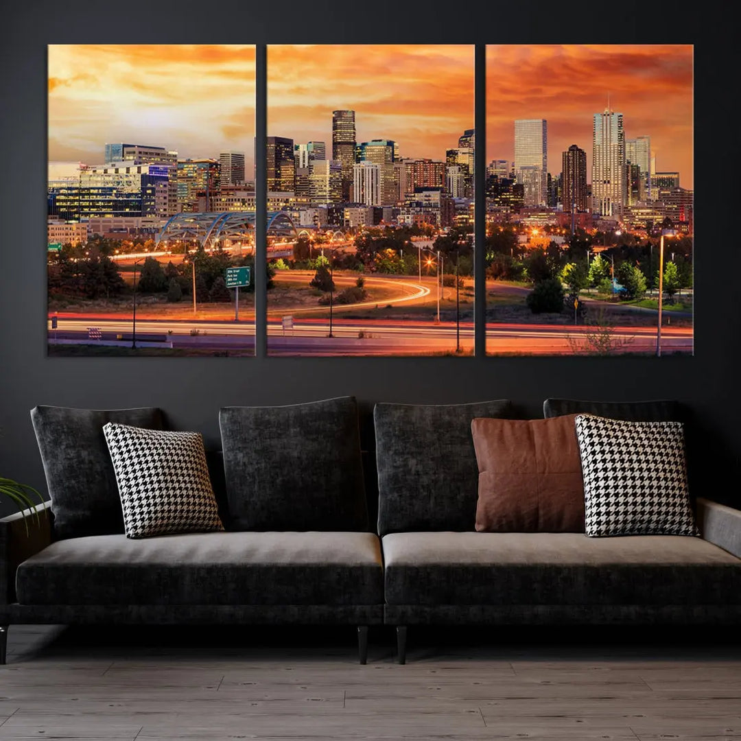 The Denver City Lights Sunset Orange Skyline Cityscape View Wall Art Canvas Print features a vibrant city skyline at sunset with orange and yellow skies. Crafted on museum-quality canvas with a UV-protective coating, it showcases the artistry of a professional craftsman.