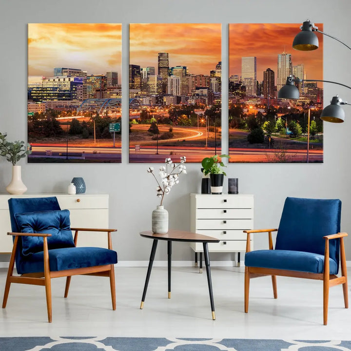 The Denver City Lights Sunset Orange Skyline Cityscape View Wall Art Canvas Print features a vibrant city skyline at sunset with orange and yellow skies. Crafted on museum-quality canvas with a UV-protective coating, it showcases the artistry of a professional craftsman.