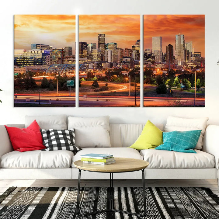 The Denver City Lights Sunset Orange Skyline Cityscape View Wall Art Canvas Print features a vibrant city skyline at sunset with orange and yellow skies. Crafted on museum-quality canvas with a UV-protective coating, it showcases the artistry of a professional craftsman.