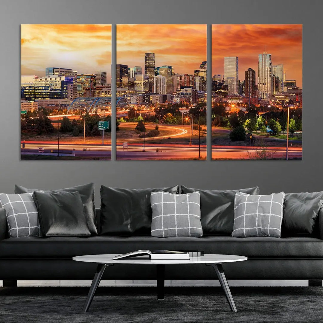 The Denver City Lights Sunset Orange Skyline Cityscape View Wall Art Canvas Print features a vibrant city skyline at sunset with orange and yellow skies. Crafted on museum-quality canvas with a UV-protective coating, it showcases the artistry of a professional craftsman.