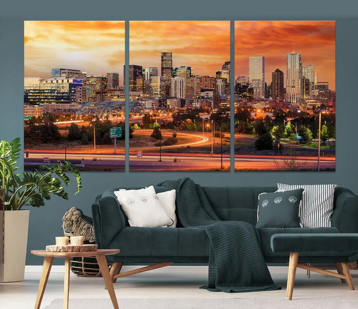 The Denver City Lights Sunset Orange Skyline Cityscape View Wall Art Canvas Print features a vibrant city skyline at sunset with orange and yellow skies. Crafted on museum-quality canvas with a UV-protective coating, it showcases the artistry of a professional craftsman.