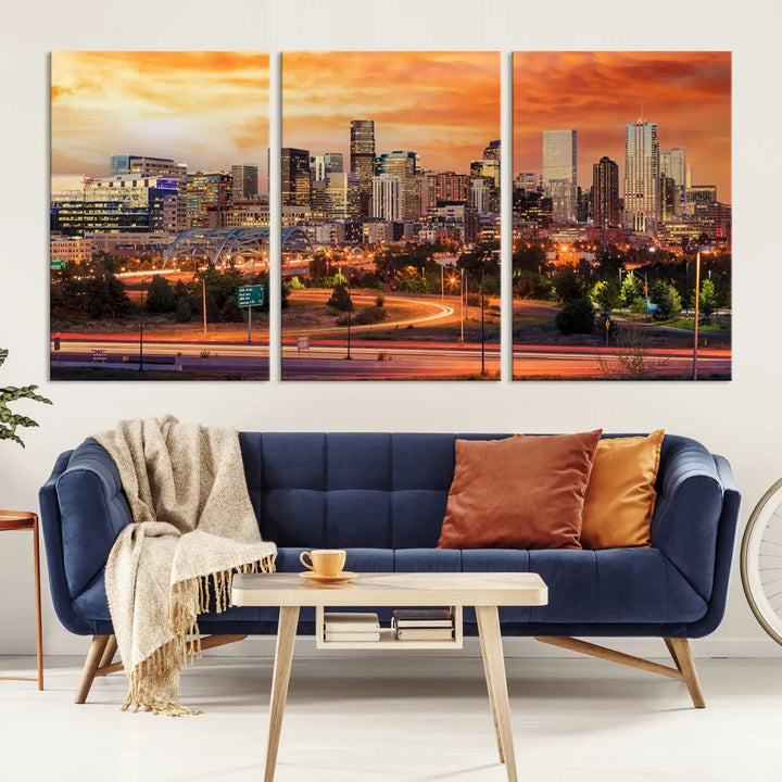 The Denver City Lights Sunset Orange Skyline Cityscape View Wall Art Canvas Print features a vibrant city skyline at sunset with orange and yellow skies. Crafted on museum-quality canvas with a UV-protective coating, it showcases the artistry of a professional craftsman.