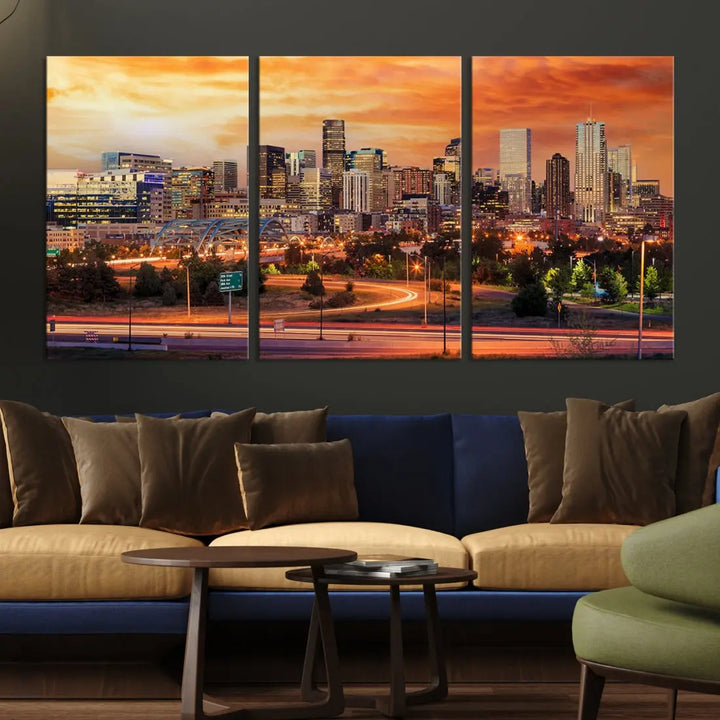 The Denver City Lights Sunset Orange Skyline Cityscape View Wall Art Canvas Print features a vibrant city skyline at sunset with orange and yellow skies. Crafted on museum-quality canvas with a UV-protective coating, it showcases the artistry of a professional craftsman.