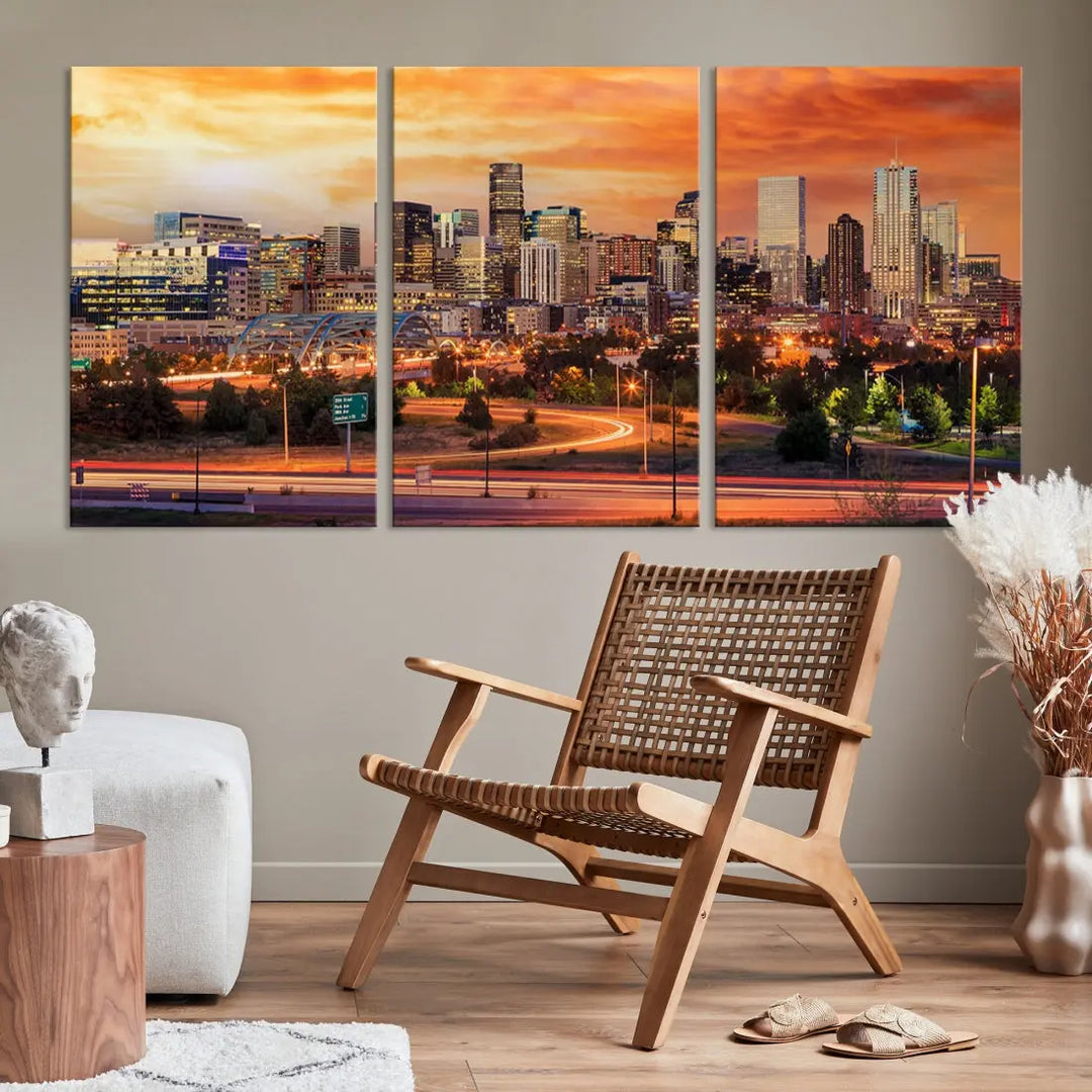 The Denver City Lights Sunset Orange Skyline Cityscape View Wall Art Canvas Print features a vibrant city skyline at sunset with orange and yellow skies. Crafted on museum-quality canvas with a UV-protective coating, it showcases the artistry of a professional craftsman.