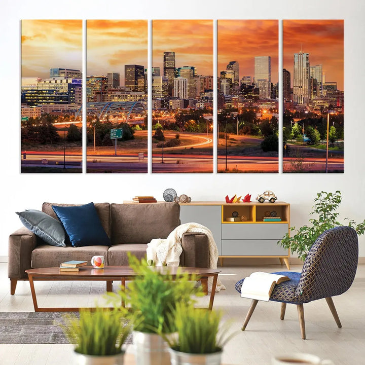 The Denver City Lights Sunset Orange Skyline Cityscape View Wall Art Canvas Print features a vibrant city skyline at sunset with orange and yellow skies. Crafted on museum-quality canvas with a UV-protective coating, it showcases the artistry of a professional craftsman.