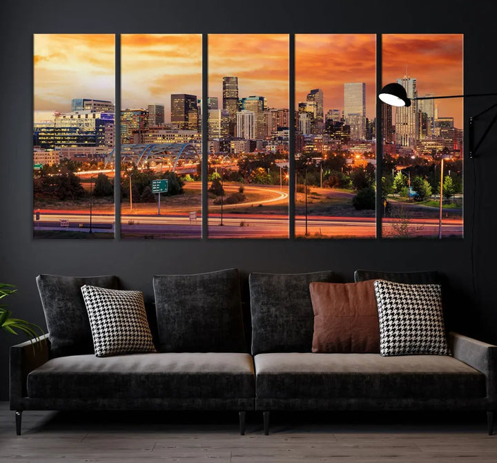 The Denver City Lights Sunset Orange Skyline Cityscape View Wall Art Canvas Print features a vibrant city skyline at sunset with orange and yellow skies. Crafted on museum-quality canvas with a UV-protective coating, it showcases the artistry of a professional craftsman.