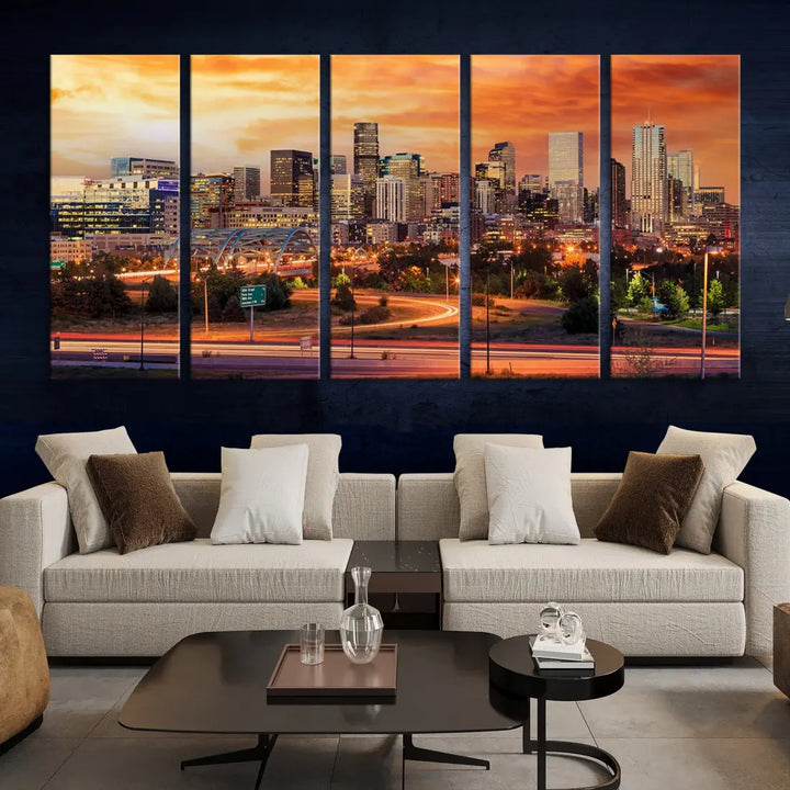 The Denver City Lights Sunset Orange Skyline Cityscape View Wall Art Canvas Print features a vibrant city skyline at sunset with orange and yellow skies. Crafted on museum-quality canvas with a UV-protective coating, it showcases the artistry of a professional craftsman.