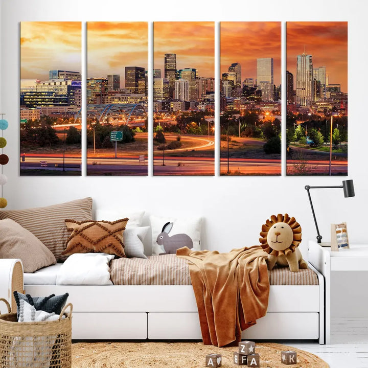 The Denver City Lights Sunset Orange Skyline Cityscape View Wall Art Canvas Print features a vibrant city skyline at sunset with orange and yellow skies. Crafted on museum-quality canvas with a UV-protective coating, it showcases the artistry of a professional craftsman.