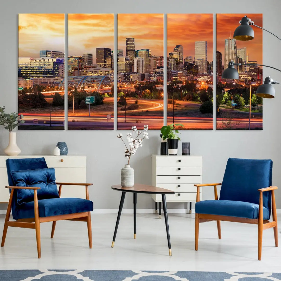 The Denver City Lights Sunset Orange Skyline Cityscape View Wall Art Canvas Print features a vibrant city skyline at sunset with orange and yellow skies. Crafted on museum-quality canvas with a UV-protective coating, it showcases the artistry of a professional craftsman.