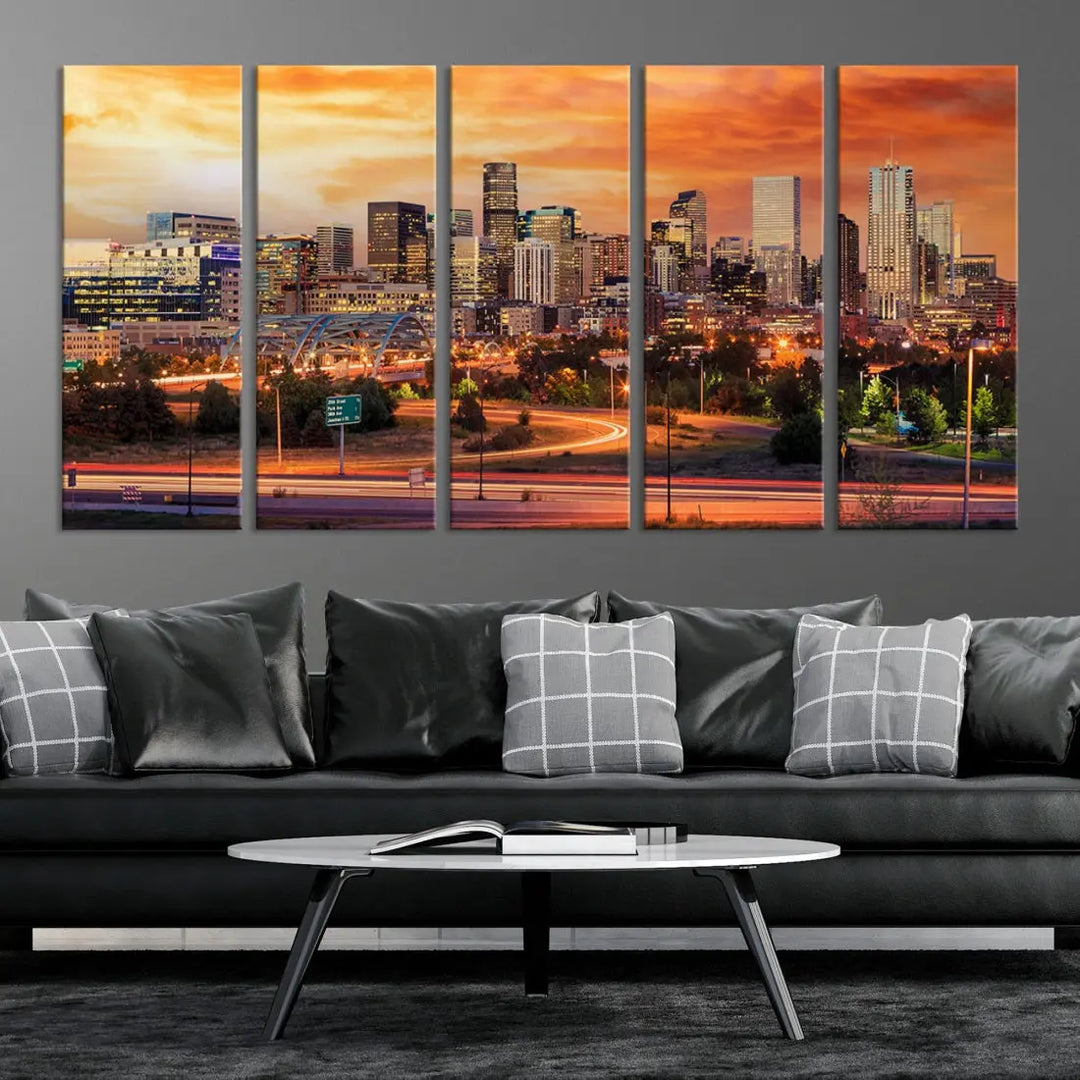 The Denver City Lights Sunset Orange Skyline Cityscape View Wall Art Canvas Print features a vibrant city skyline at sunset with orange and yellow skies. Crafted on museum-quality canvas with a UV-protective coating, it showcases the artistry of a professional craftsman.