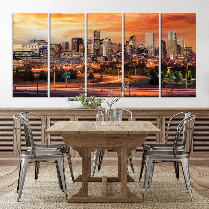 The Denver City Lights Sunset Orange Skyline Cityscape View Wall Art Canvas Print features a vibrant city skyline at sunset with orange and yellow skies. Crafted on museum-quality canvas with a UV-protective coating, it showcases the artistry of a professional craftsman.