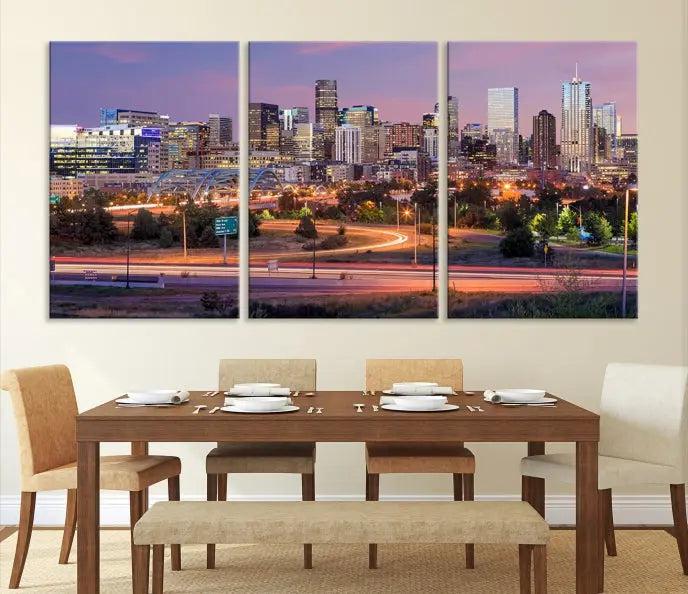 The cozy living room is adorned with a triptych of the "Denver City Lights Sunset Purple Skyline Cityscape View Wall Art Canvas Print." Professionally hand-assembled, these museum-quality canvases bring elegance and sophistication to the space, complemented by the convenience of free shipping.