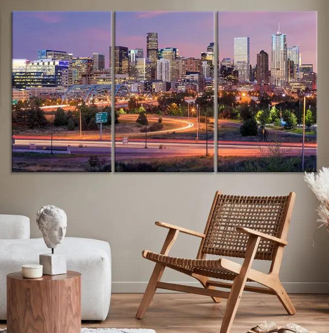 The cozy living room is adorned with a triptych of the "Denver City Lights Sunset Purple Skyline Cityscape View Wall Art Canvas Print." Professionally hand-assembled, these museum-quality canvases bring elegance and sophistication to the space, complemented by the convenience of free shipping.