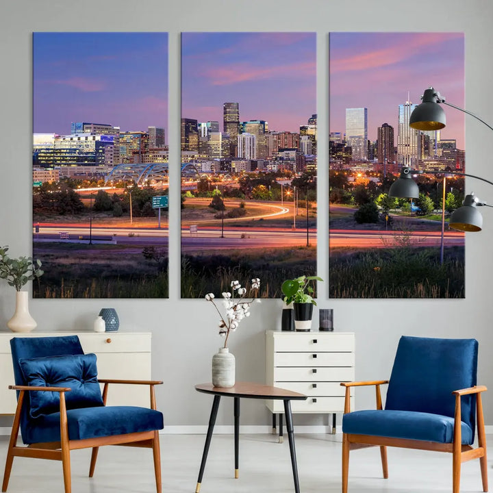 The Denver City Lights Sunset Purple Skyline Cityscape View Wall Art Canvas Print is crafted on museum-quality canvas with a UV-protective coating. It is displayed on a wall.