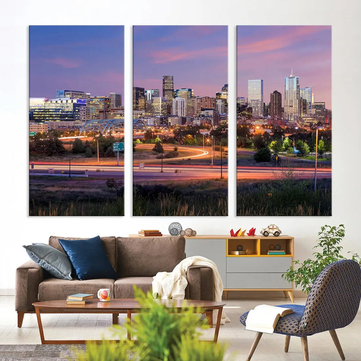 The Denver City Lights Sunset Purple Skyline Cityscape View Wall Art Canvas Print is crafted on museum-quality canvas with a UV-protective coating. It is displayed on a wall.