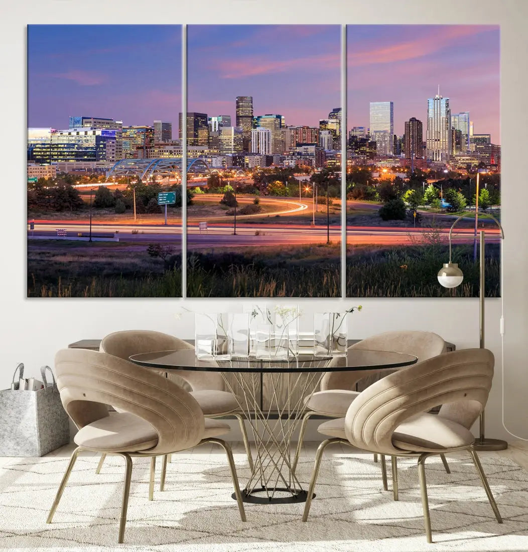 The Denver City Lights Sunset Purple Skyline Cityscape View Wall Art Canvas Print is crafted on museum-quality canvas with a UV-protective coating. It is displayed on a wall.