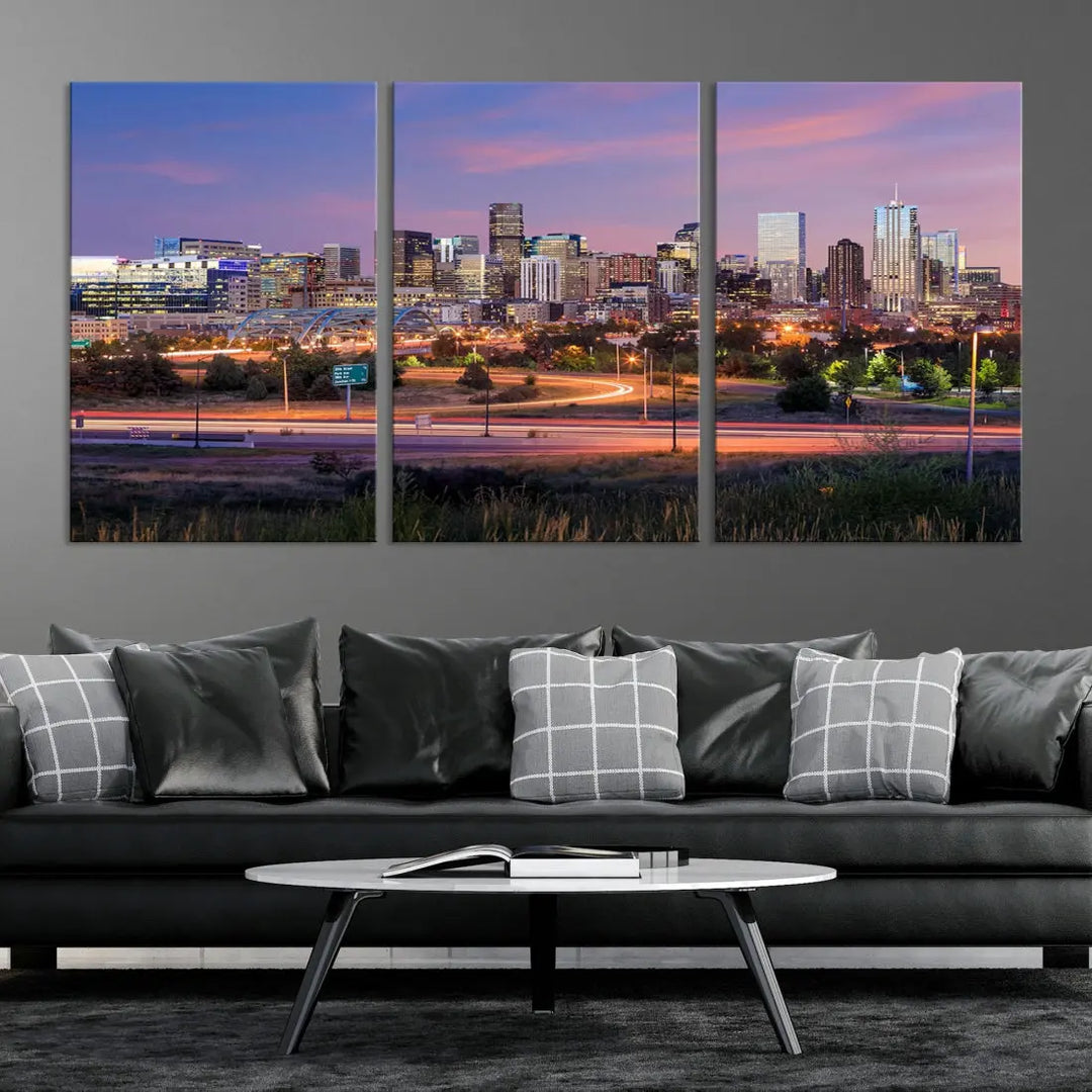 The Denver City Lights Sunset Purple Skyline Cityscape View Wall Art Canvas Print is crafted on museum-quality canvas with a UV-protective coating. It is displayed on a wall.