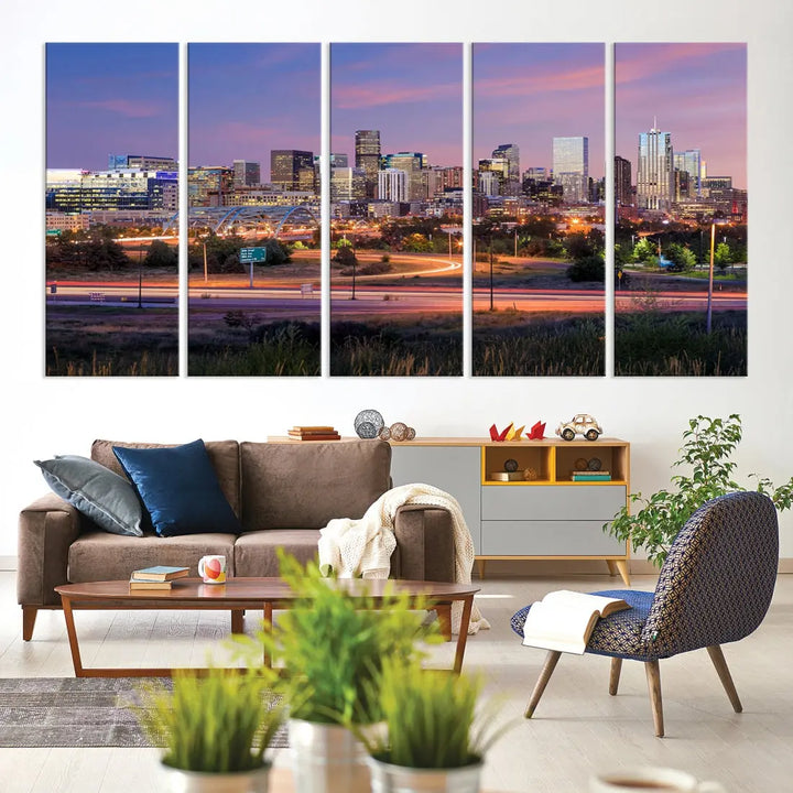 The Denver City Lights Sunset Purple Skyline Cityscape View Wall Art Canvas Print is crafted on museum-quality canvas with a UV-protective coating. It is displayed on a wall.