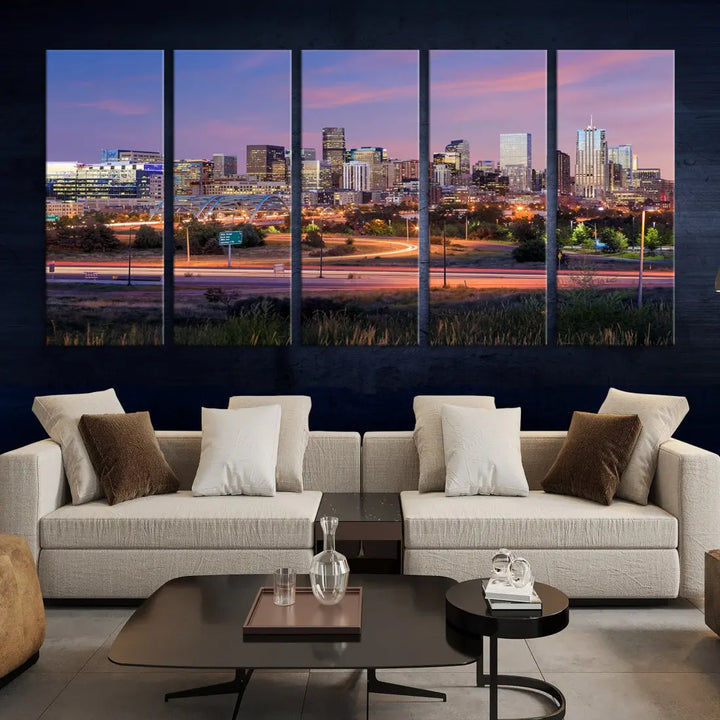 The Denver City Lights Sunset Purple Skyline Cityscape View Wall Art Canvas Print is crafted on museum-quality canvas with a UV-protective coating. It is displayed on a wall.