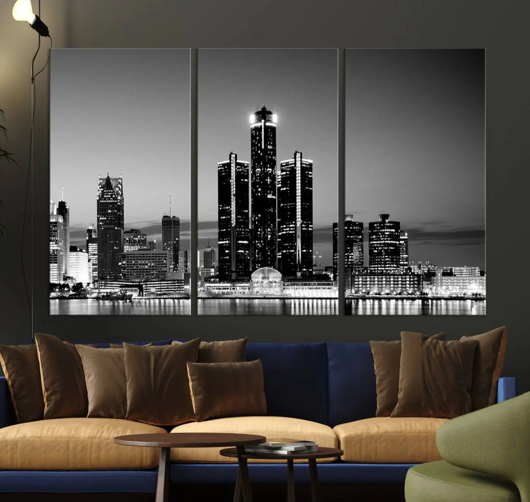 A modern living room showcases the Detroit City Lights Skyline Black and White Wall Art Cityscape Canvas Print on the wall, featuring museum-quality canvases crafted by professional artisans.