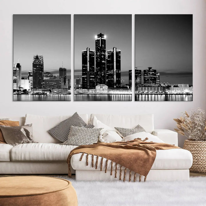 A modern living room showcases the Detroit City Lights Skyline Black and White Wall Art Cityscape Canvas Print on the wall, featuring museum-quality canvases crafted by professional artisans.