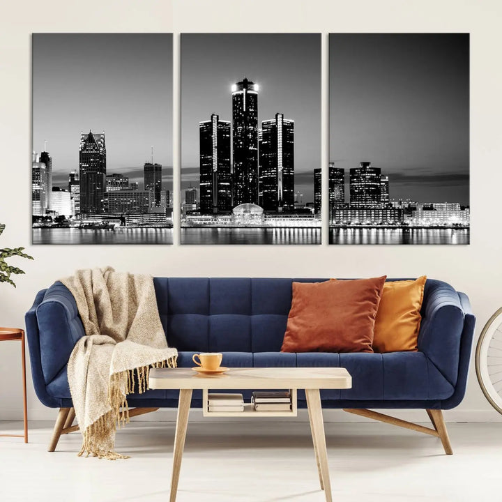 A modern living room showcases the Detroit City Lights Skyline Black and White Wall Art Cityscape Canvas Print on the wall, featuring museum-quality canvases crafted by professional artisans.