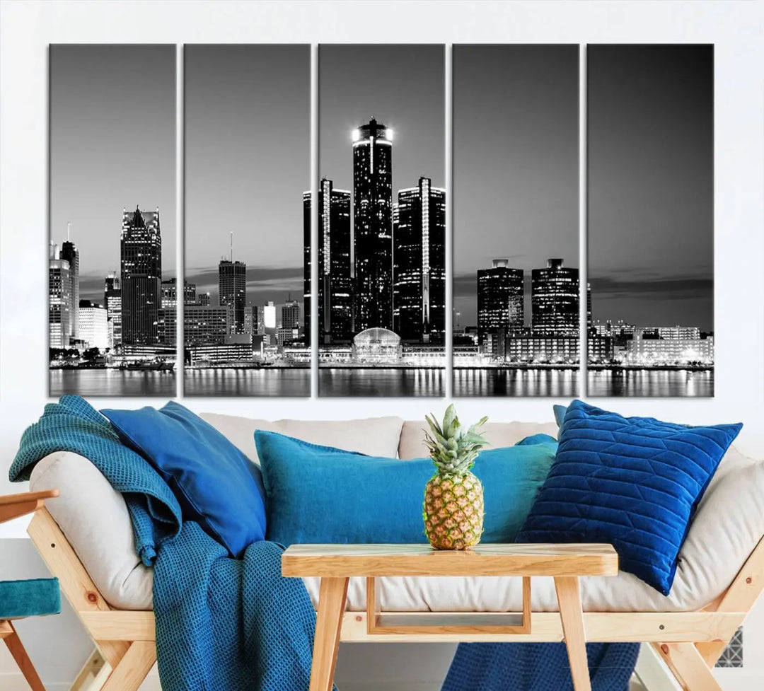 A modern living room showcases the Detroit City Lights Skyline Black and White Wall Art Cityscape Canvas Print on the wall, featuring museum-quality canvases crafted by professional artisans.