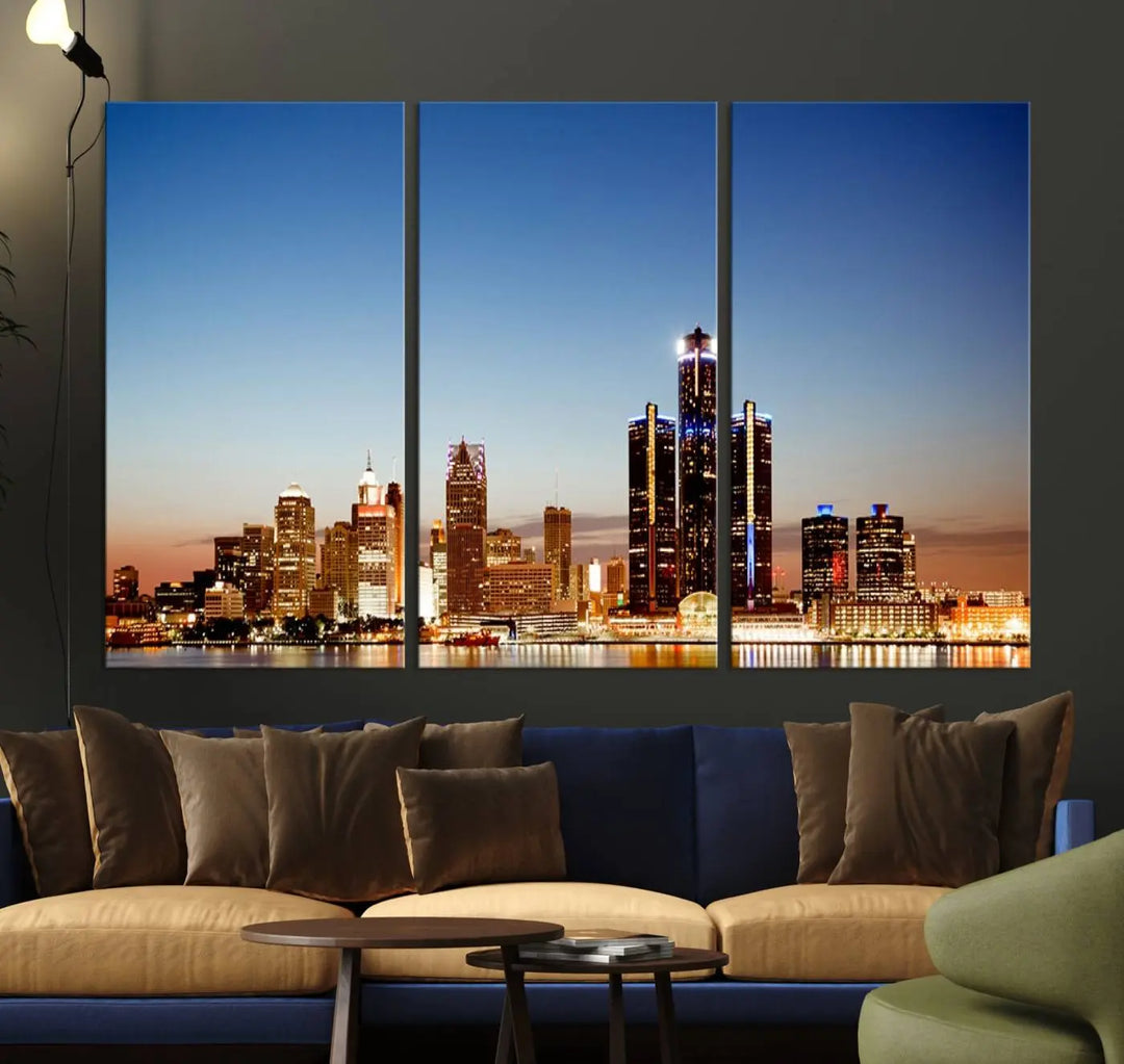 The Detroit City Lights Sunset Skyline Cityscape View Wall Art Canvas Print is displayed as a triptych. This artwork is printed on museum-quality canvas with a UV-protective coating and includes free shipping.