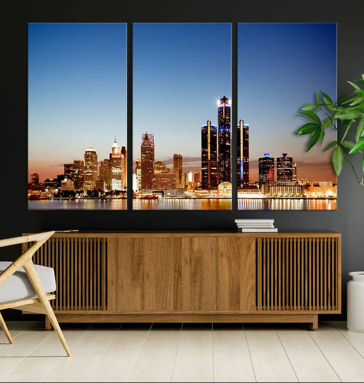 The Detroit City Lights Sunset Skyline Cityscape View Wall Art Canvas Print is displayed as a triptych. This artwork is printed on museum-quality canvas with a UV-protective coating and includes free shipping.