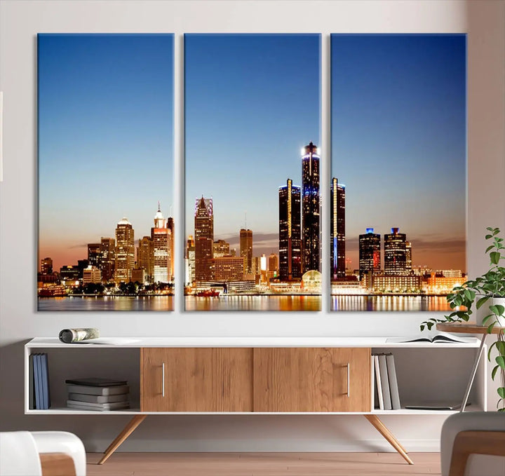 The Detroit City Lights Sunset Skyline Cityscape View Wall Art Canvas Print is displayed as a triptych. This artwork is printed on museum-quality canvas with a UV-protective coating and includes free shipping.