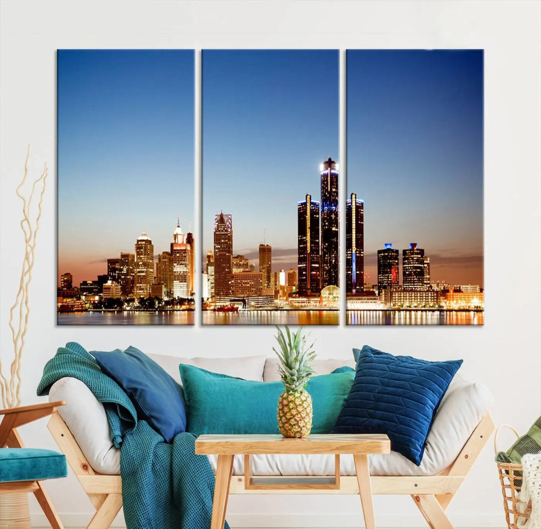 The Detroit City Lights Sunset Skyline Cityscape View Wall Art Canvas Print is displayed as a triptych. This artwork is printed on museum-quality canvas with a UV-protective coating and includes free shipping.