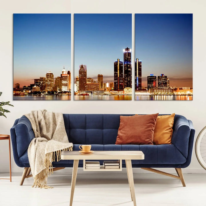 The Detroit City Lights Sunset Skyline Cityscape View Wall Art Canvas Print is displayed as a triptych. This artwork is printed on museum-quality canvas with a UV-protective coating and includes free shipping.