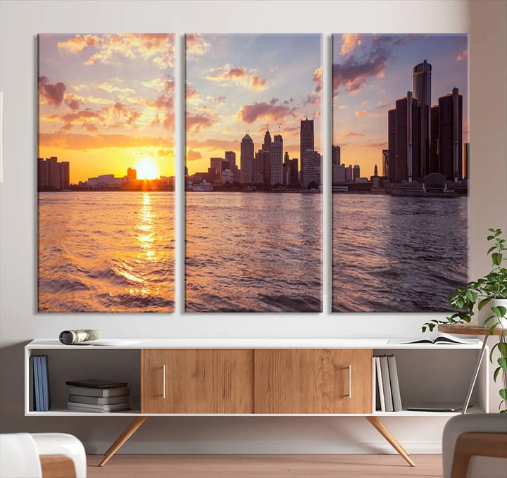 The Detroit City Sunset Skyline Cityscape View Wall Art Canvas Print, featuring a UV-protective coating, beautifully depicts a city skyline at sunset over a river. Enjoy free shipping on these museum-quality canvases, ideal for elevating your living space.