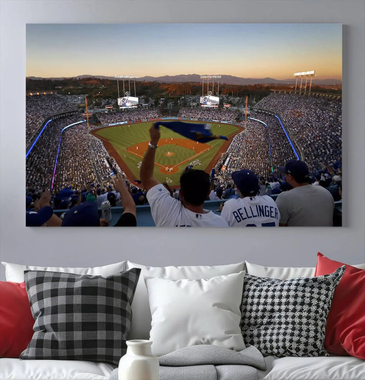 Experience the vibrant moment captured in the Dodger Stadium Sunset Game Triple Canvas Wall Art. This stunning three-panel piece showcases a breathtaking scene from a Los Angeles Dodgers MLB game during sunset, complete with cheering fans in the background.