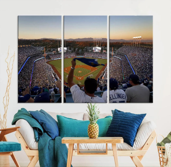 Experience the vibrant moment captured in the Dodger Stadium Sunset Game Triple Canvas Wall Art. This stunning three-panel piece showcases a breathtaking scene from a Los Angeles Dodgers MLB game during sunset, complete with cheering fans in the background.