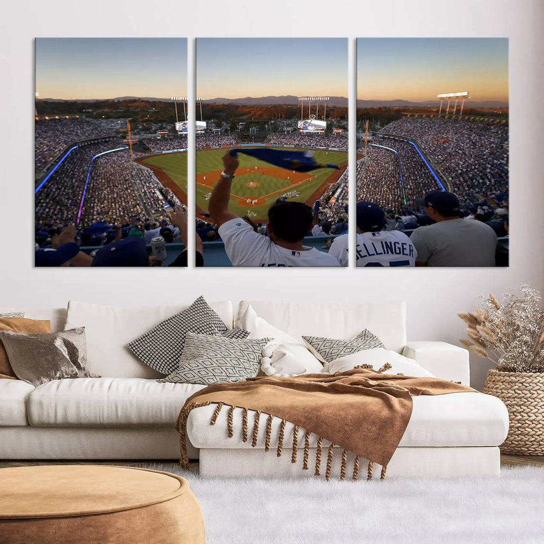 Experience the vibrant moment captured in the Dodger Stadium Sunset Game Triple Canvas Wall Art. This stunning three-panel piece showcases a breathtaking scene from a Los Angeles Dodgers MLB game during sunset, complete with cheering fans in the background.