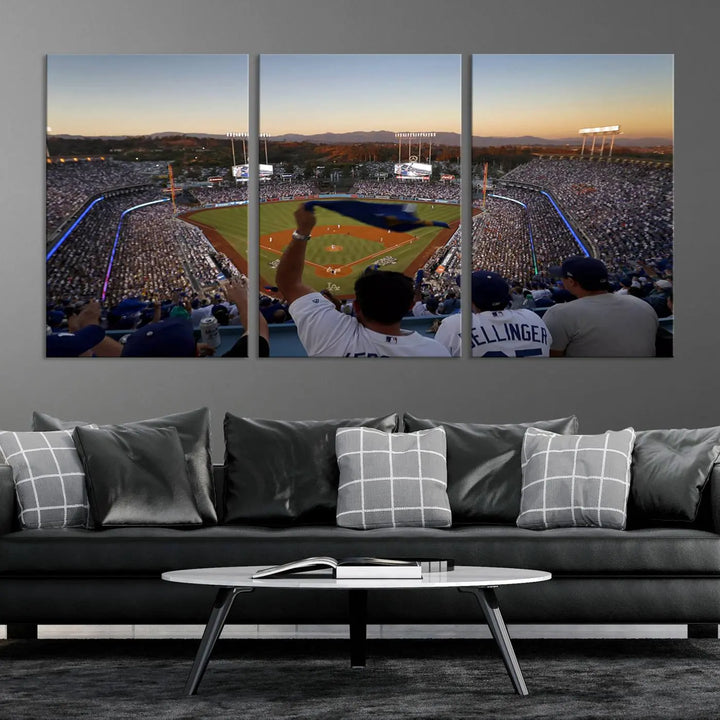 Experience the vibrant moment captured in the Dodger Stadium Sunset Game Triple Canvas Wall Art. This stunning three-panel piece showcases a breathtaking scene from a Los Angeles Dodgers MLB game during sunset, complete with cheering fans in the background.