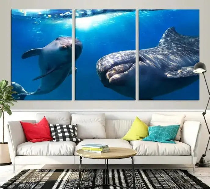 The Dolphin and Ocean Life Wall Art Canvas Print, a museum-quality piece depicting dolphins swimming, is a stunning artwork offered with free shipping.