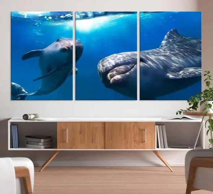 The Dolphin and Ocean Life Wall Art Canvas Print, a museum-quality piece depicting dolphins swimming, is a stunning artwork offered with free shipping.