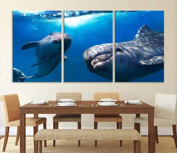 The Dolphin and Ocean Life Wall Art Canvas Print, a museum-quality piece depicting dolphins swimming, is a stunning artwork offered with free shipping.