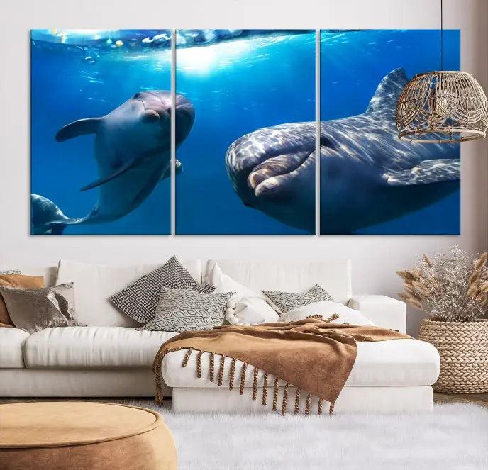 The Dolphin and Ocean Life Wall Art Canvas Print, a museum-quality piece depicting dolphins swimming, is a stunning artwork offered with free shipping.